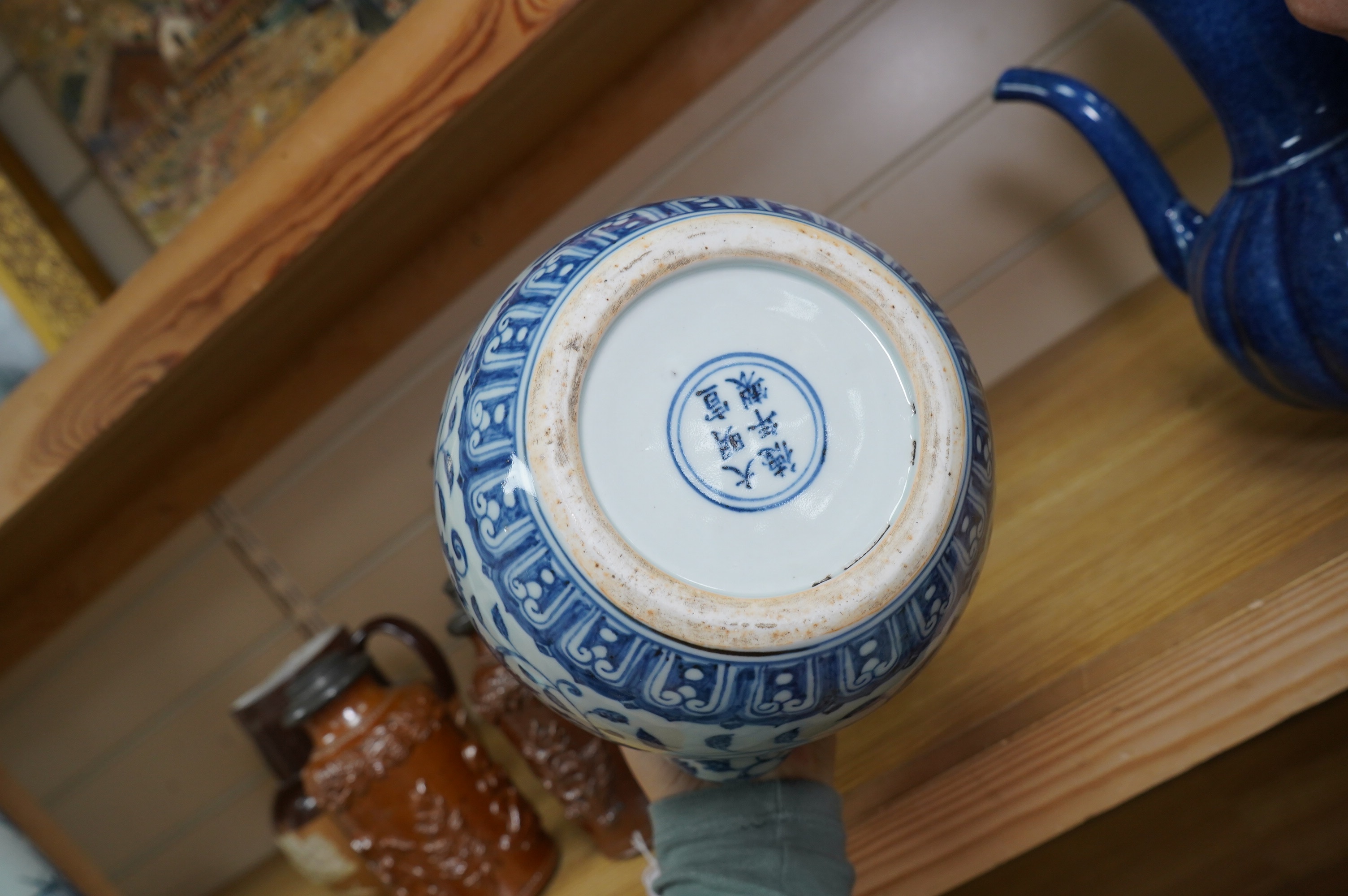 A Chinese porcelain powder blue ewer with cover and a similar blue and white example, largest 25cm high. Condition - good